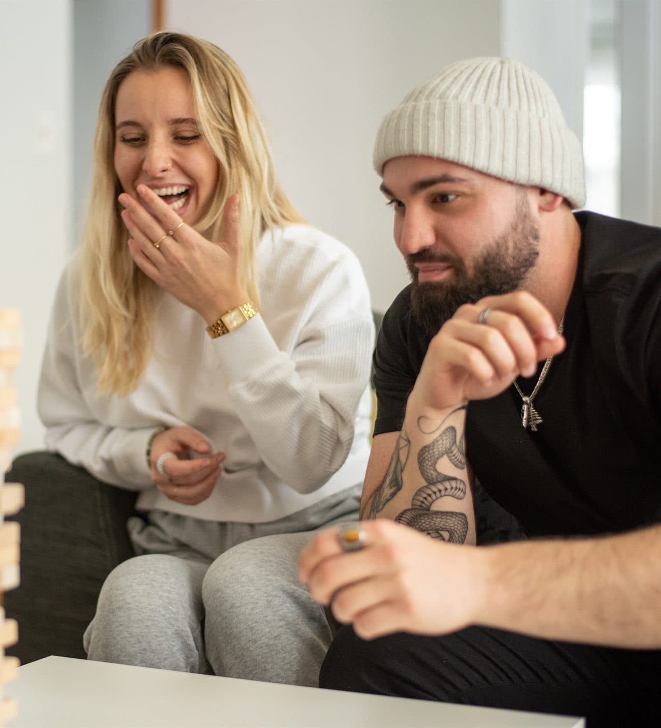 Two people sharing a warm, genuine moment of connection and laughter.